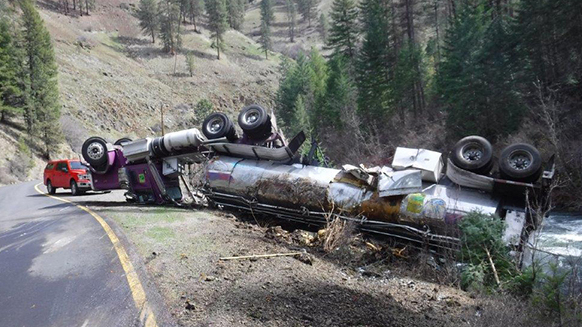 Truck carrying salmon overturns, sending the fish into the wrong stream : NPR 5 040224 fishtankeraccident wide d297efcb0825fd60291e911bc0d91511b80f078d