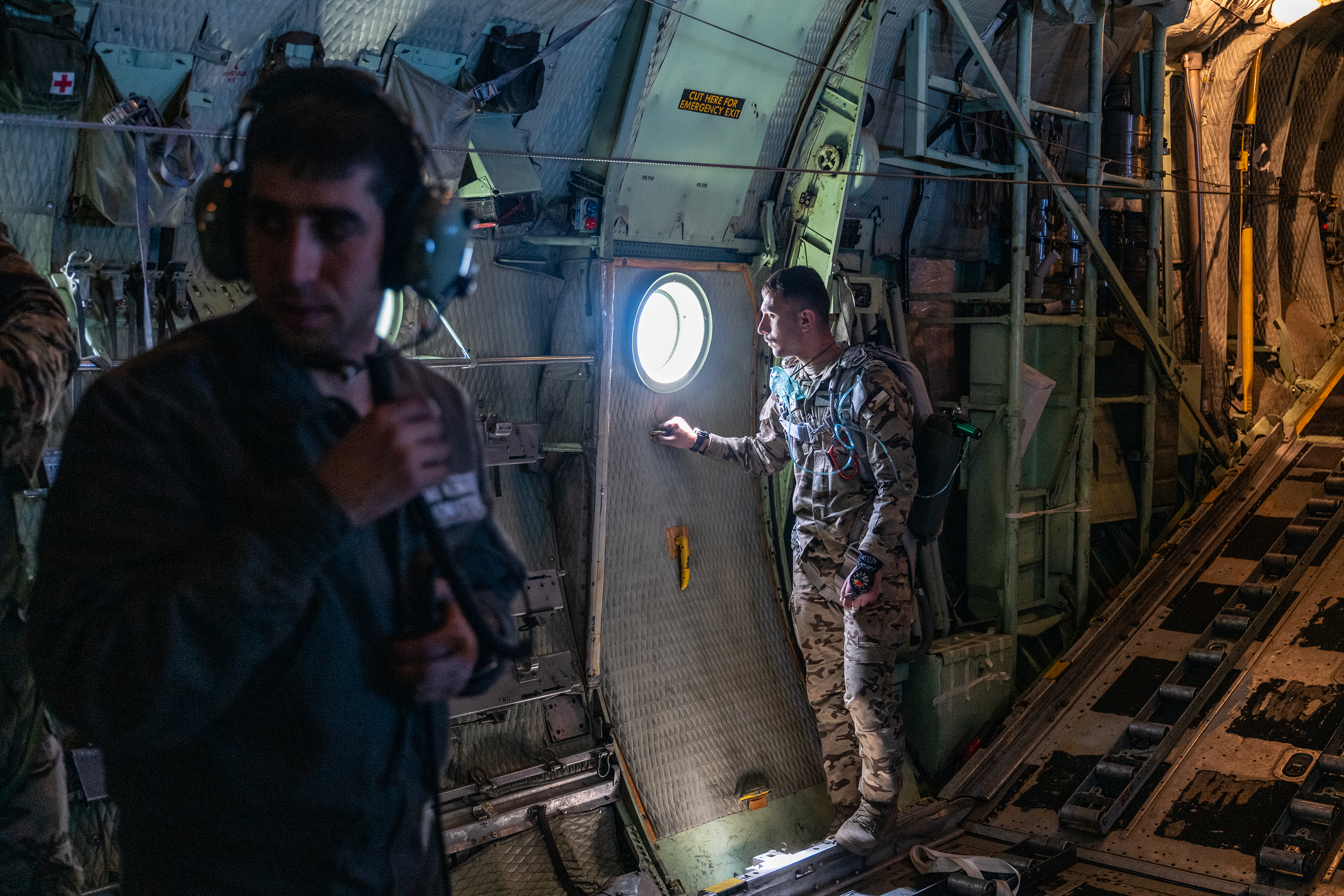 Jordanian air force personnel stand inside a C-130 aircraft after airdropping pallets of aid over Gaza in March.