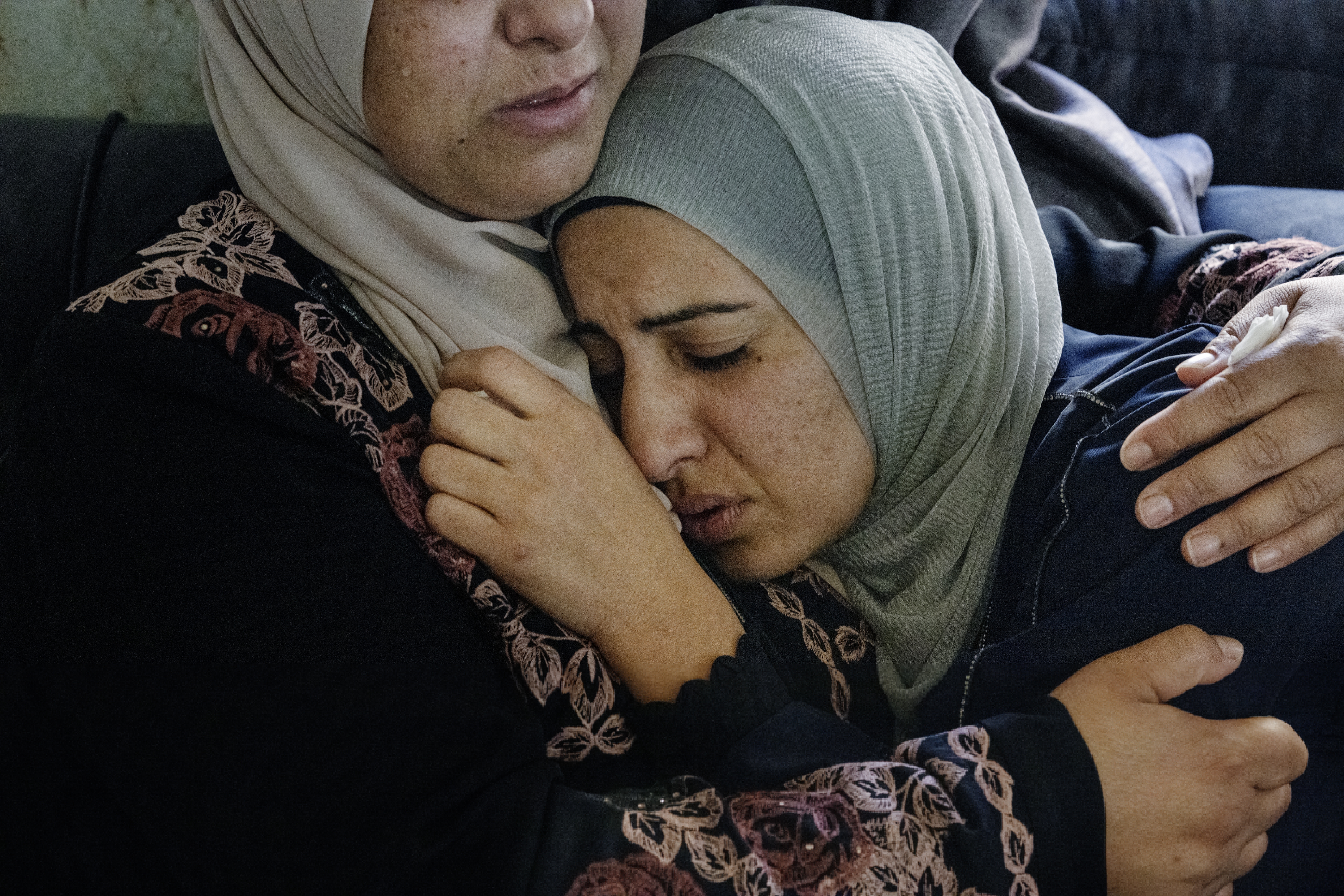 Sisters, wives, mothers and cousins of residents in the village of Qusra in the West Bank gather to mourn their Palestinian loved ones killed by armed Israeli settlers just days after the Oct. 7 Hamas-led attack.