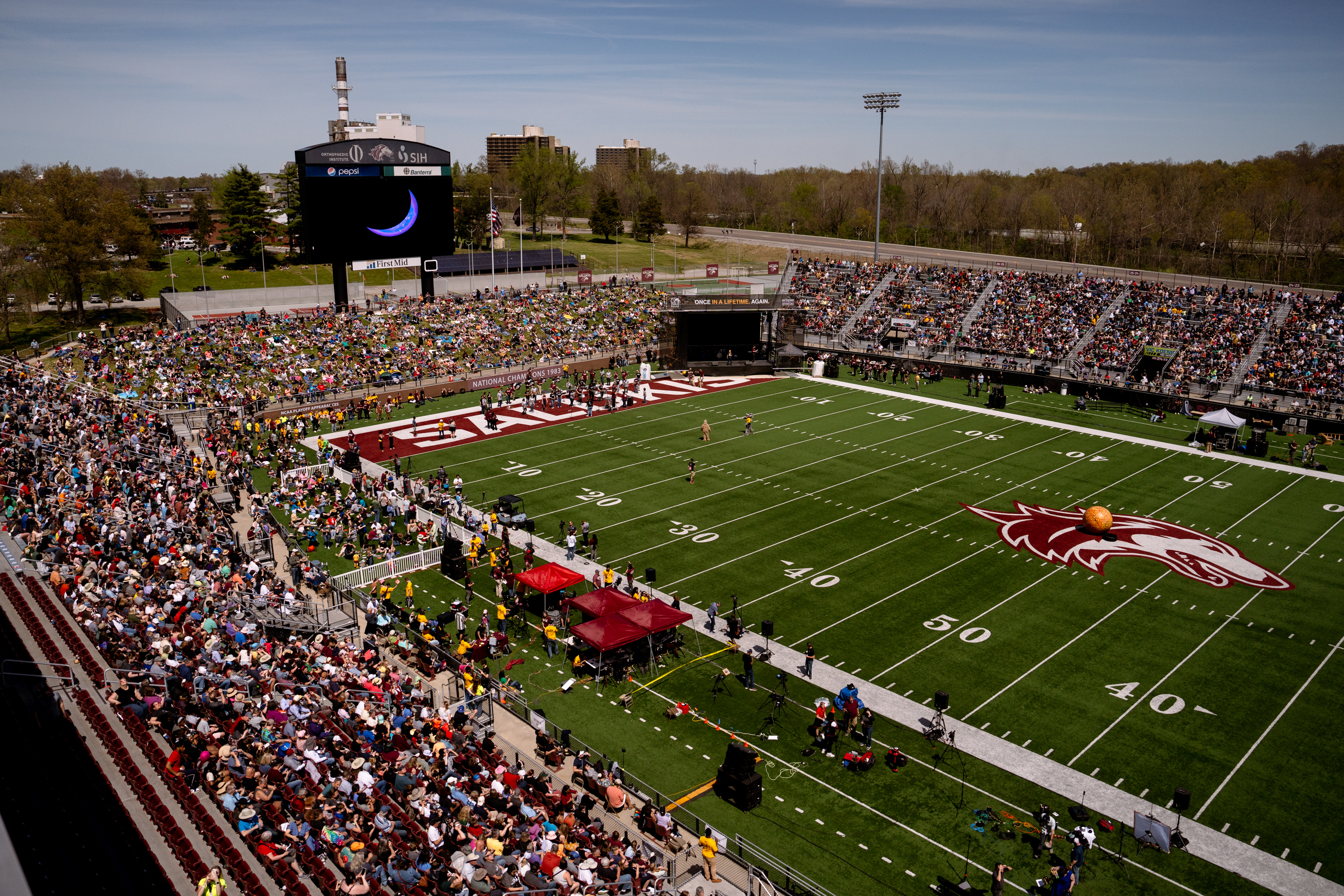 Thousands pack into Saluki Stadium to watch the total solar eclipse in Carbondale, Ill.