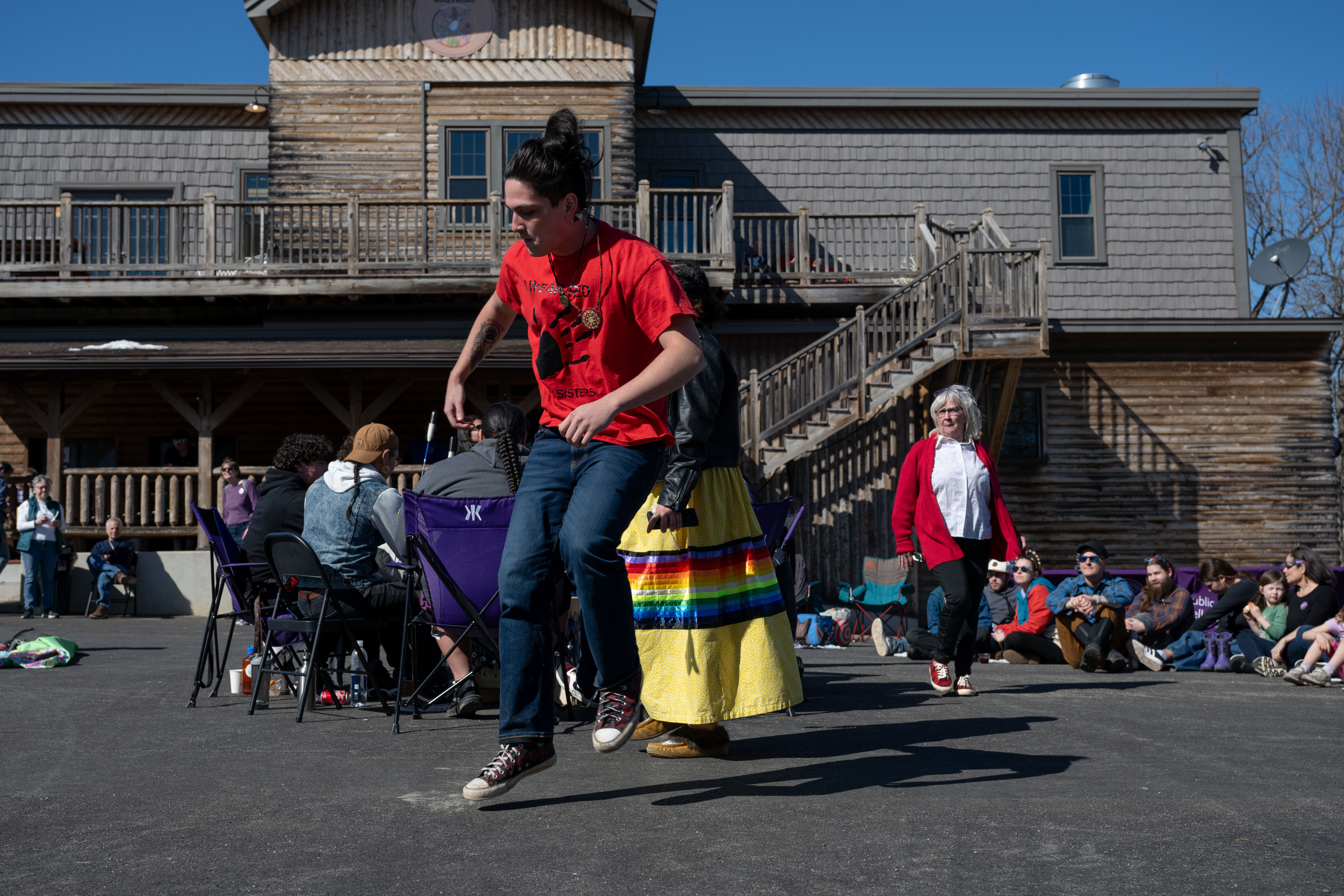 Sipayik resident Chris Sockbeson, center, who belongs to the Passamaquoddy tribe and of the Turning Eagle Drum Group, dances as the group plays in Millinocket, Maine.