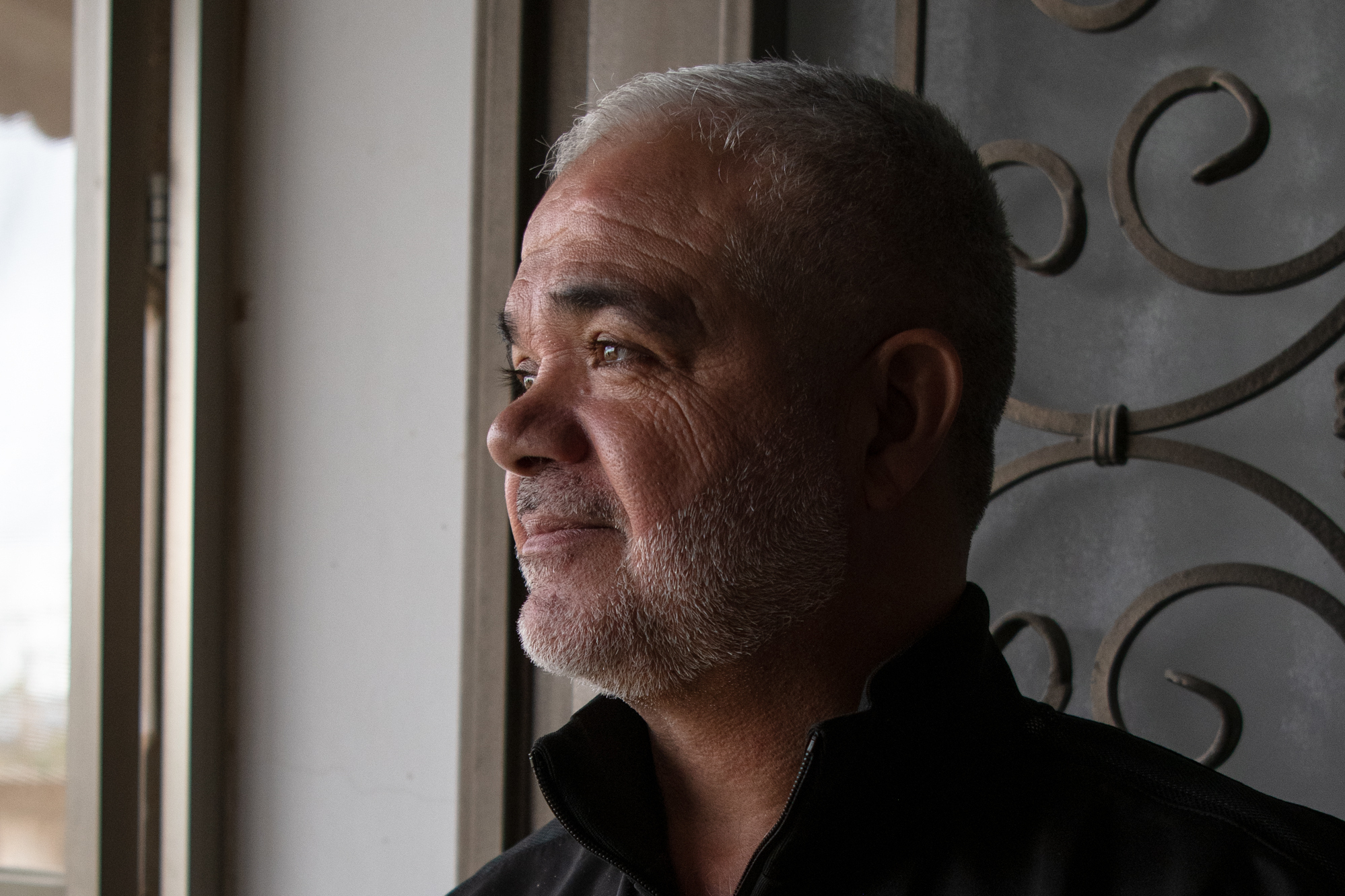 Pastry maker Rafe' Rummaneh, shown here in his home outside Ramallah in the occupied West Bank on April 9, is only making a few treats for friends this Eid. (Catie Dull/NPR)
