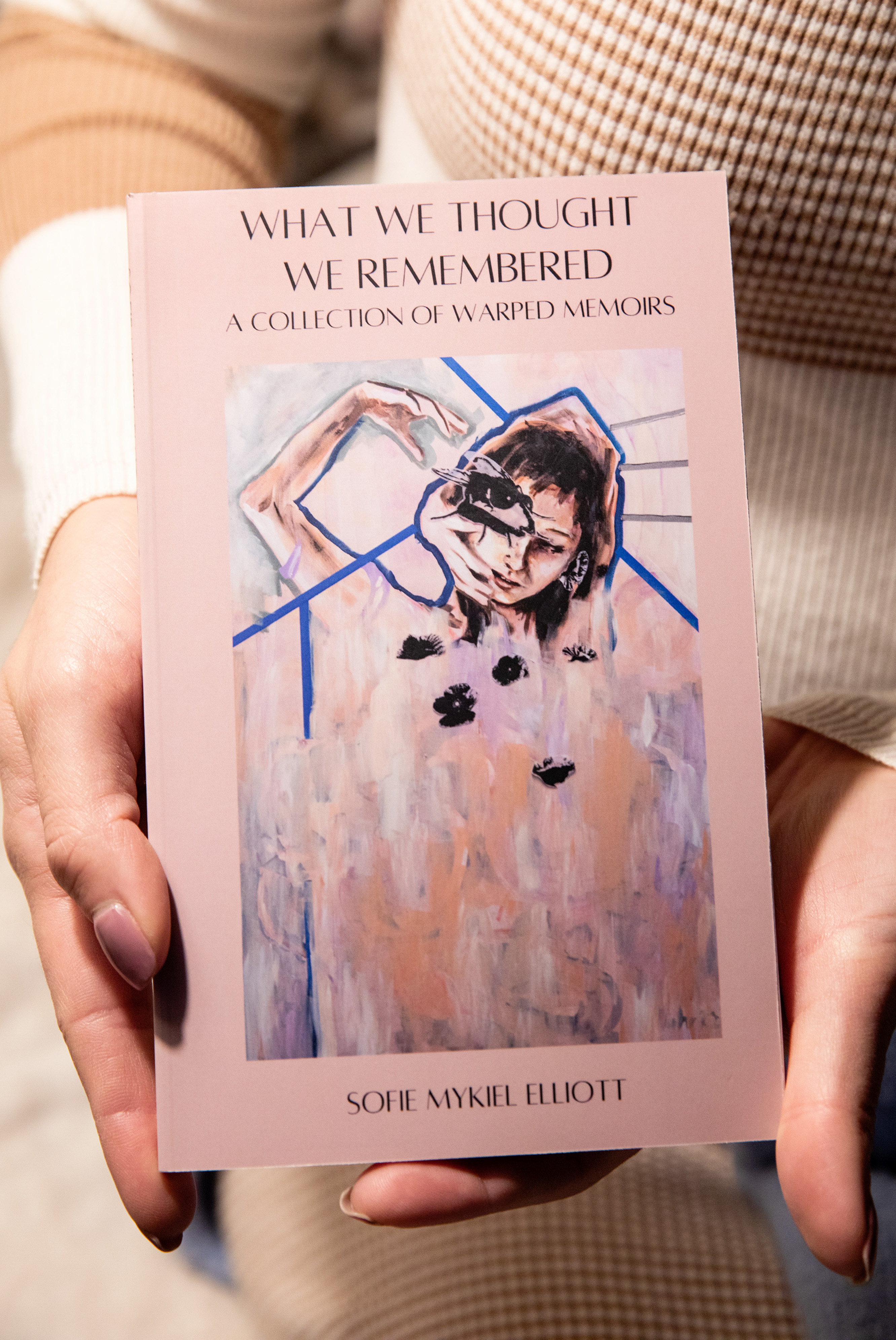 Sisters make peace with dark memories through art, science and each other 3 Sofie Elliott displays the book she wrote about her and her sister's shared project about memories.