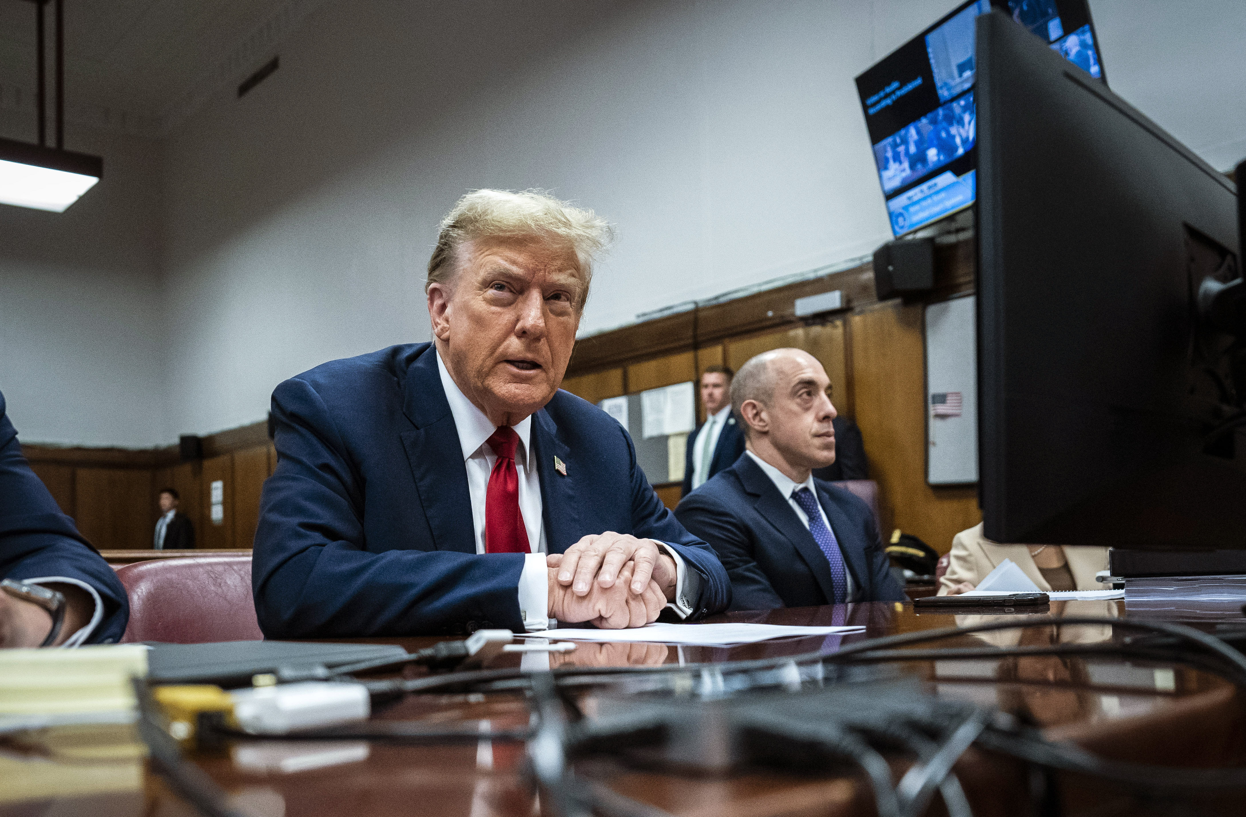 Former President Donald Trump appears with his legal team ahead of the start of jury selection Monday at Manhattan criminal court. Trump faces 34 felony counts of falsifying business records in the first of his criminal cases to go to trial. (Pool/Getty Images)