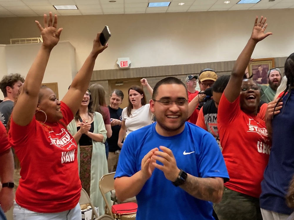 Volkswagen workers in Chattanooga, Tenn., celebrate as results from the union election at the auto plant come in on April 19, 2024. The final tally was 2,628 votes in favor of unionizing and 985 against. (Gulf States Newsroom)