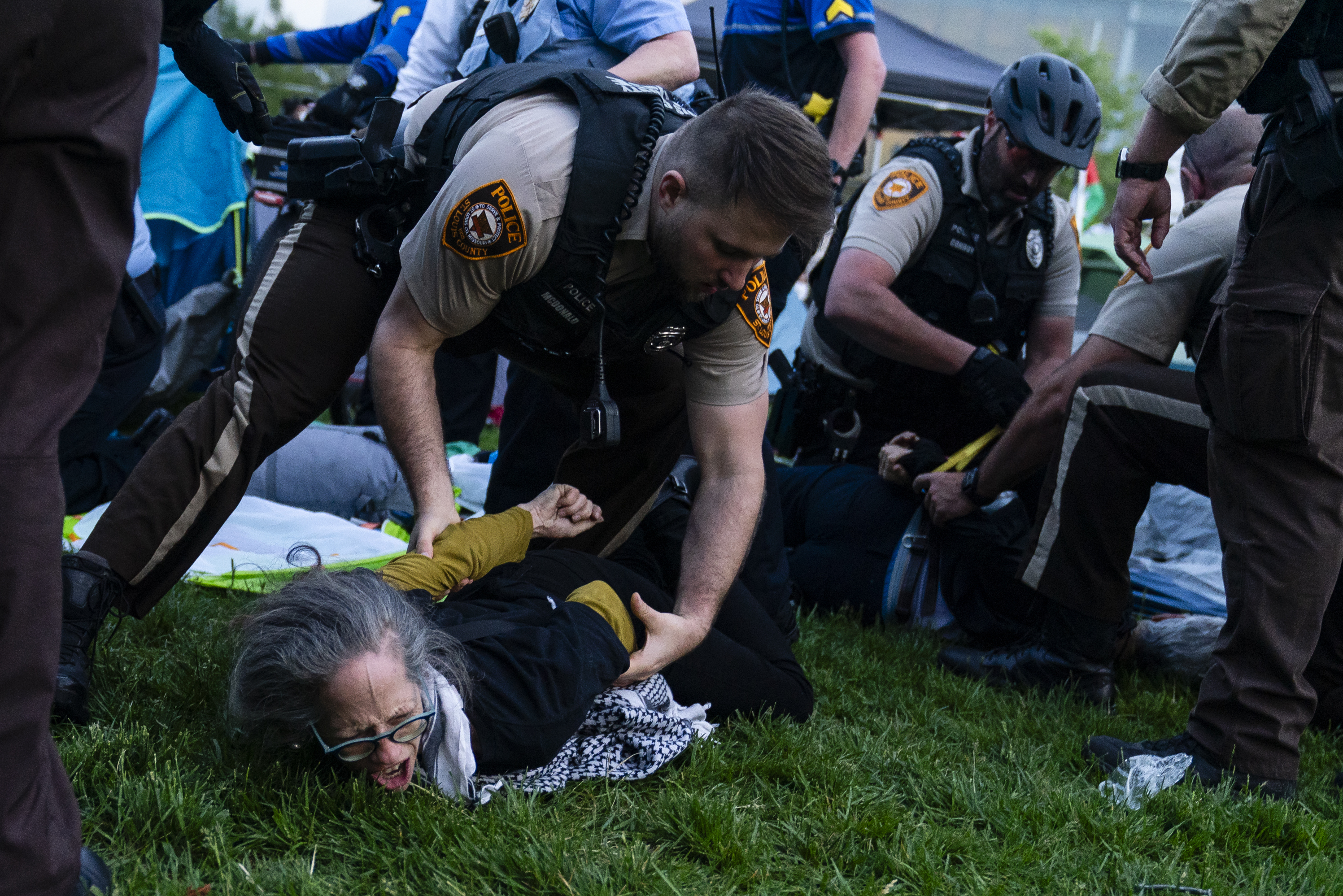 Members of the Washington University community are arrested on Saturday, April 27, 2024. (St. Louis Public Radio)
