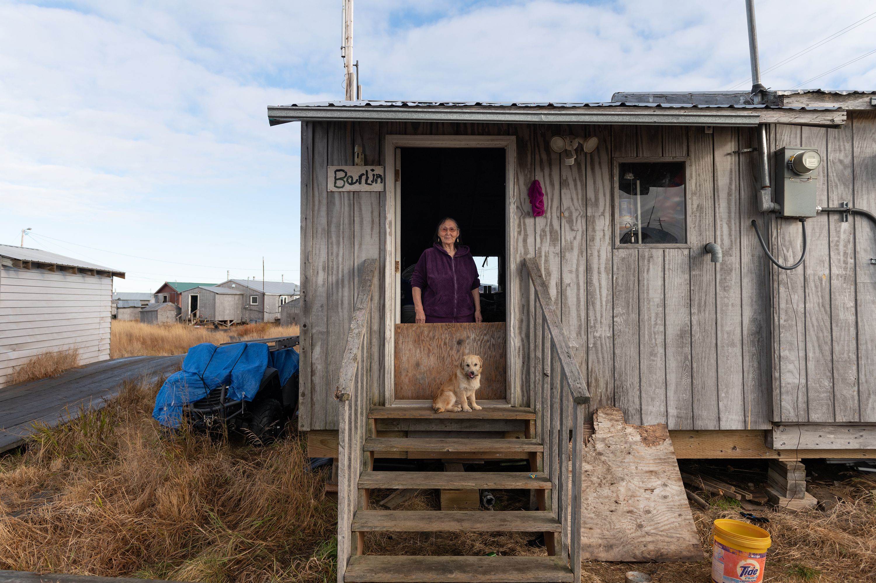 Agnes Berlin at home on the Akiuk side of Kasigluk, Oct. 18, 2023. Berlin, who is in her late 70s, said she dreamed once there were orange and apple trees growing on the tundra. It's something her elders told her would happen one day — as people strayed from tradition, the winters would warm.