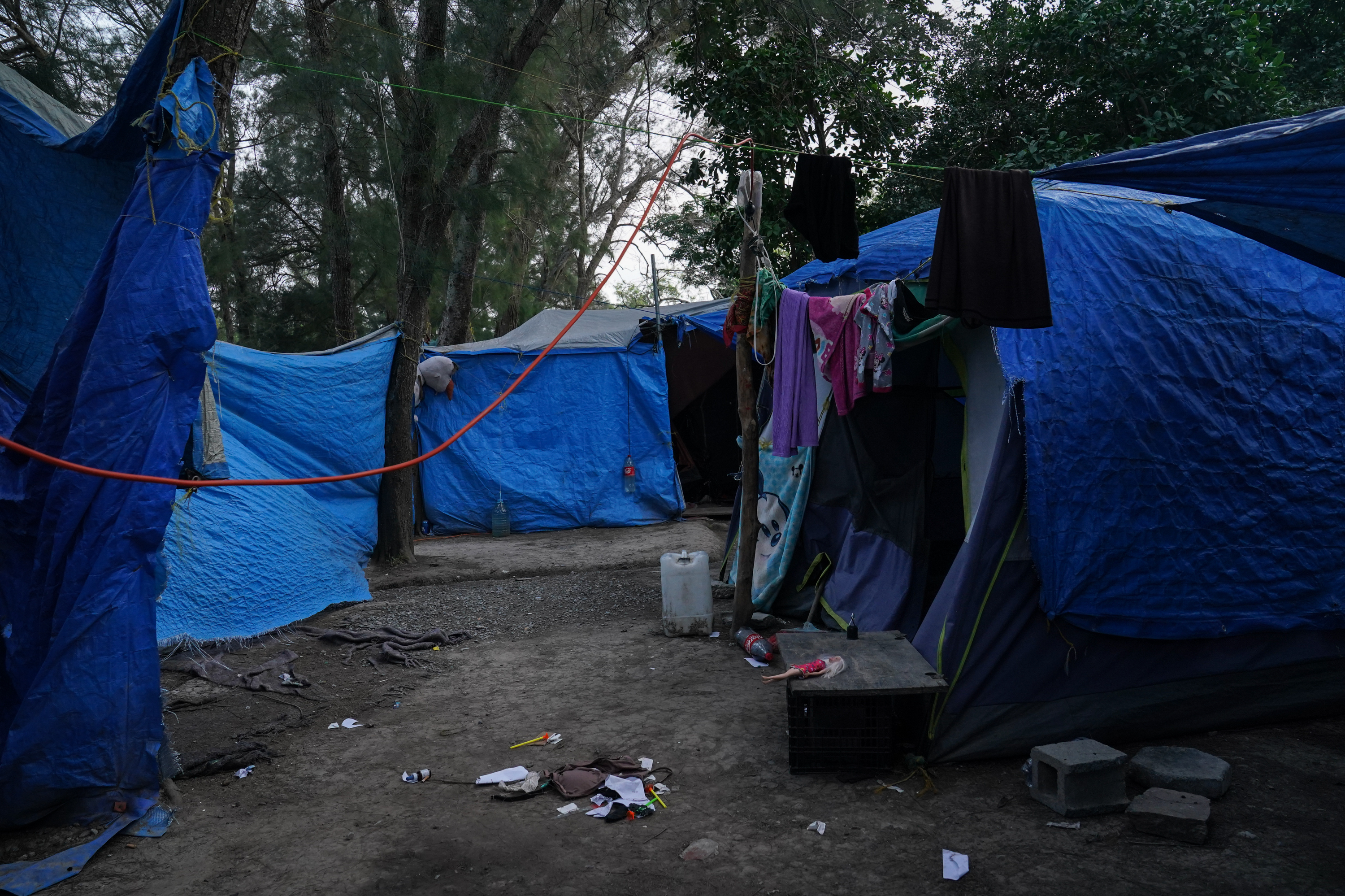 Abandoned tents remain at the migrant camp in Matamoros, Mexico, that is at the center of a controversy involving viral images of a flyer encouraging migrants to vote for President Biden. (Verónica Gabriela Cárdenas for NPR)