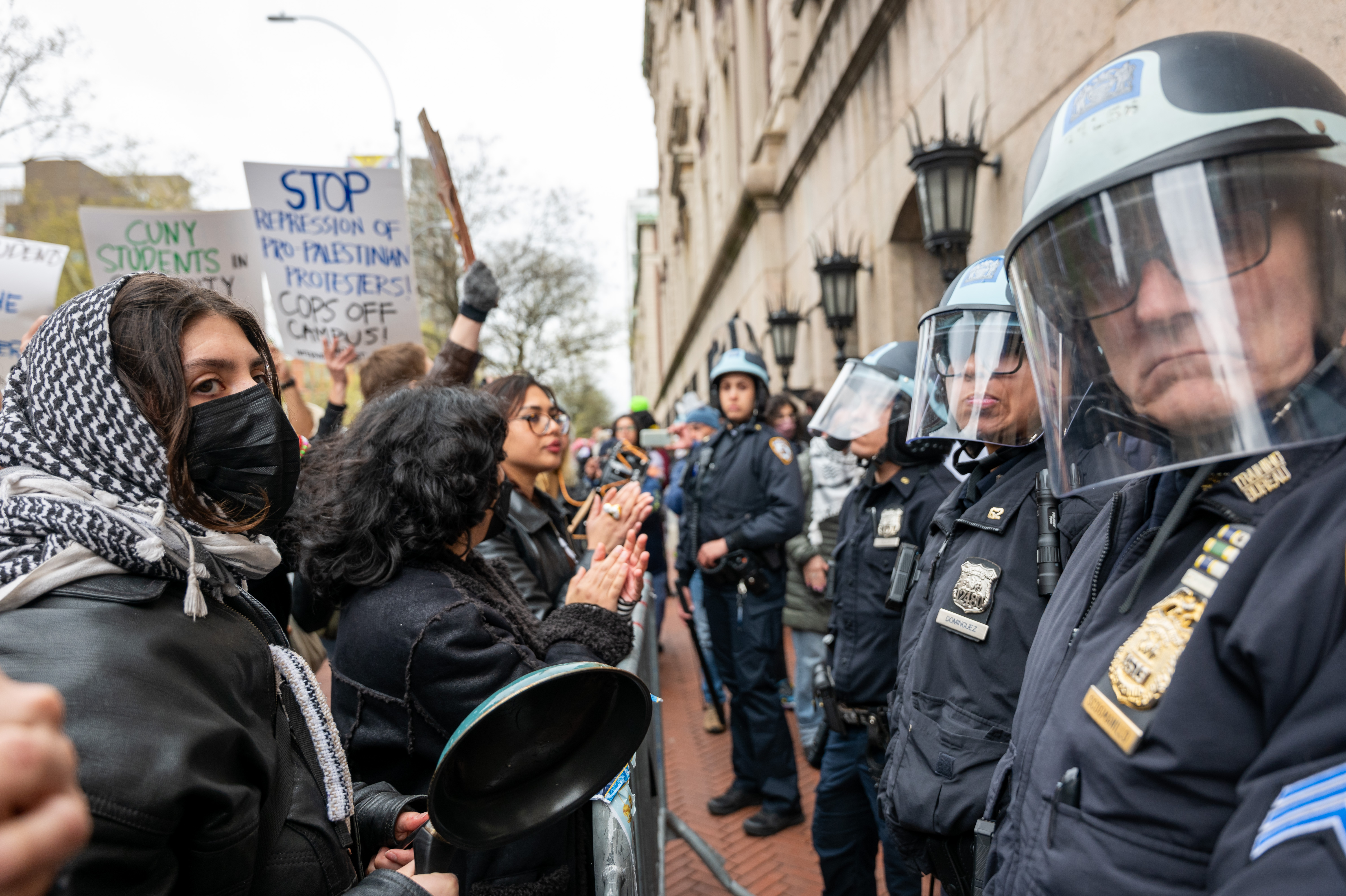 Students and pro-Palestinian activists face police as they gather outside of Columbia University to protest the university's stance on Israel's war in Gaza. (Getty Images)
