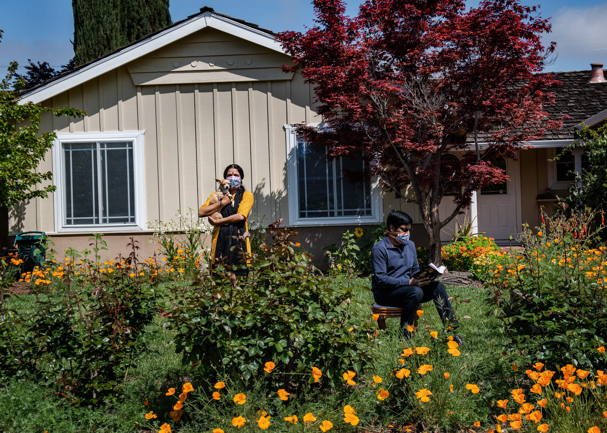 How the pandemic led this documentary photographer to make her work more collaborative 5 Nitya and Arvind Kansal pose with their dog, Kuku, in front of their Cupertino, Calif., home in April 2020.
