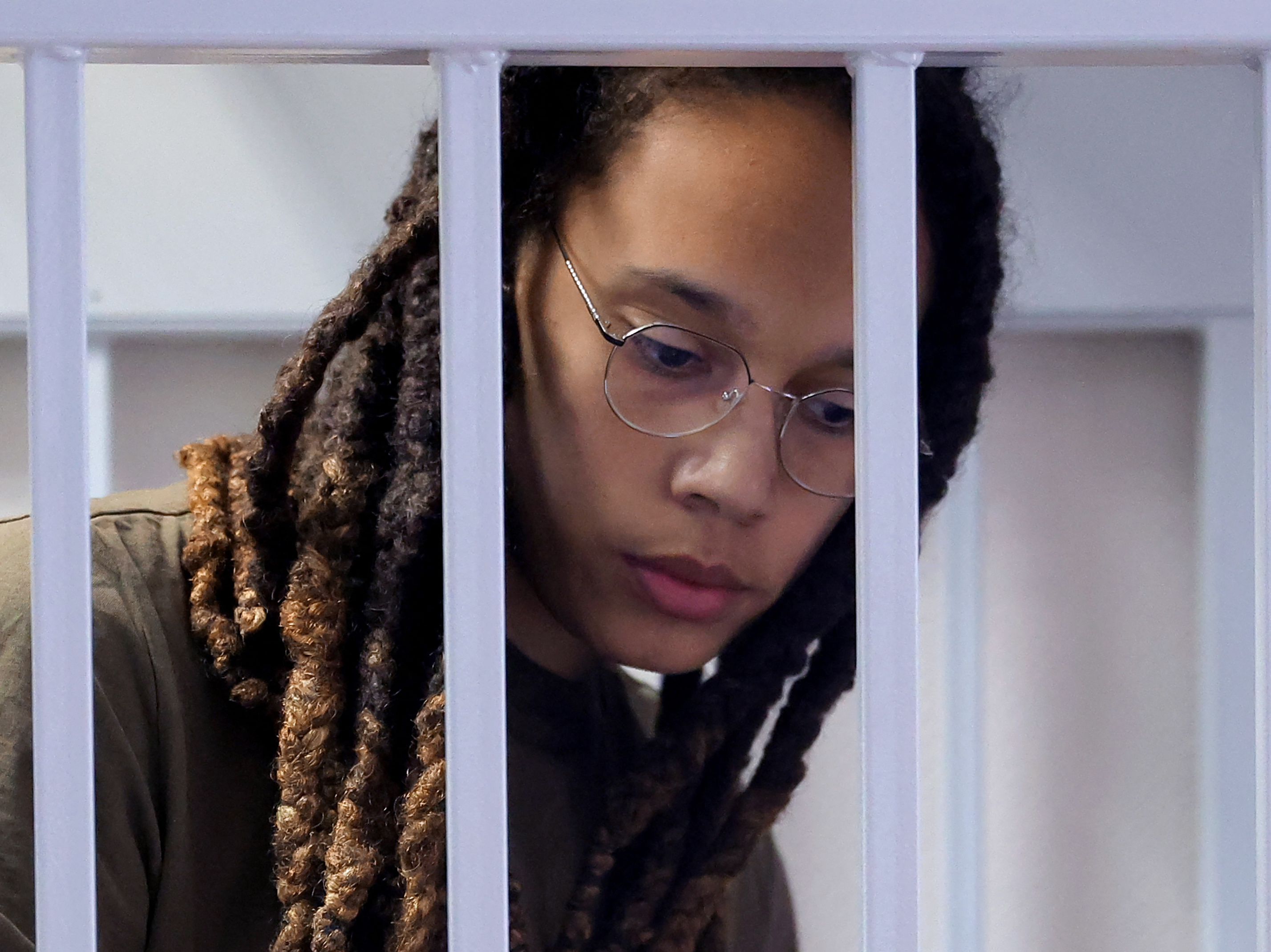 Brittney Griner stands in a defendants' cage before a court hearing in Khimki, Russia, on Aug. 2, 2022. (POOL/AFP via Getty Images)
