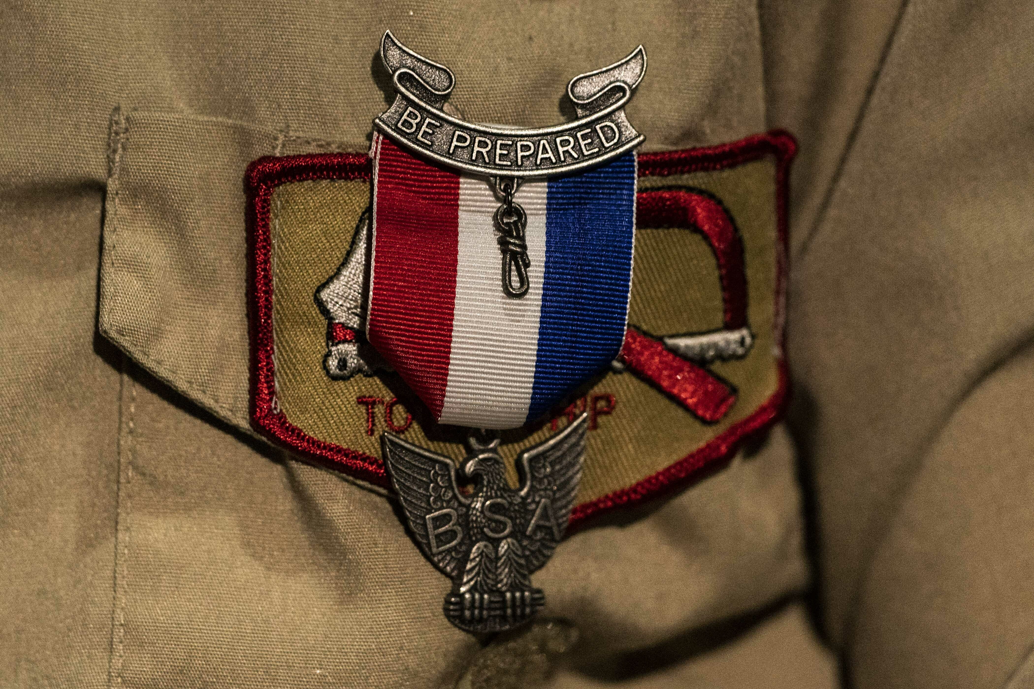 An Eagle Scout Award is seen pinned to a uniform. The Pentagon, which has considered cutting ties to Scouting America, is moving toward maintaining the relationship.