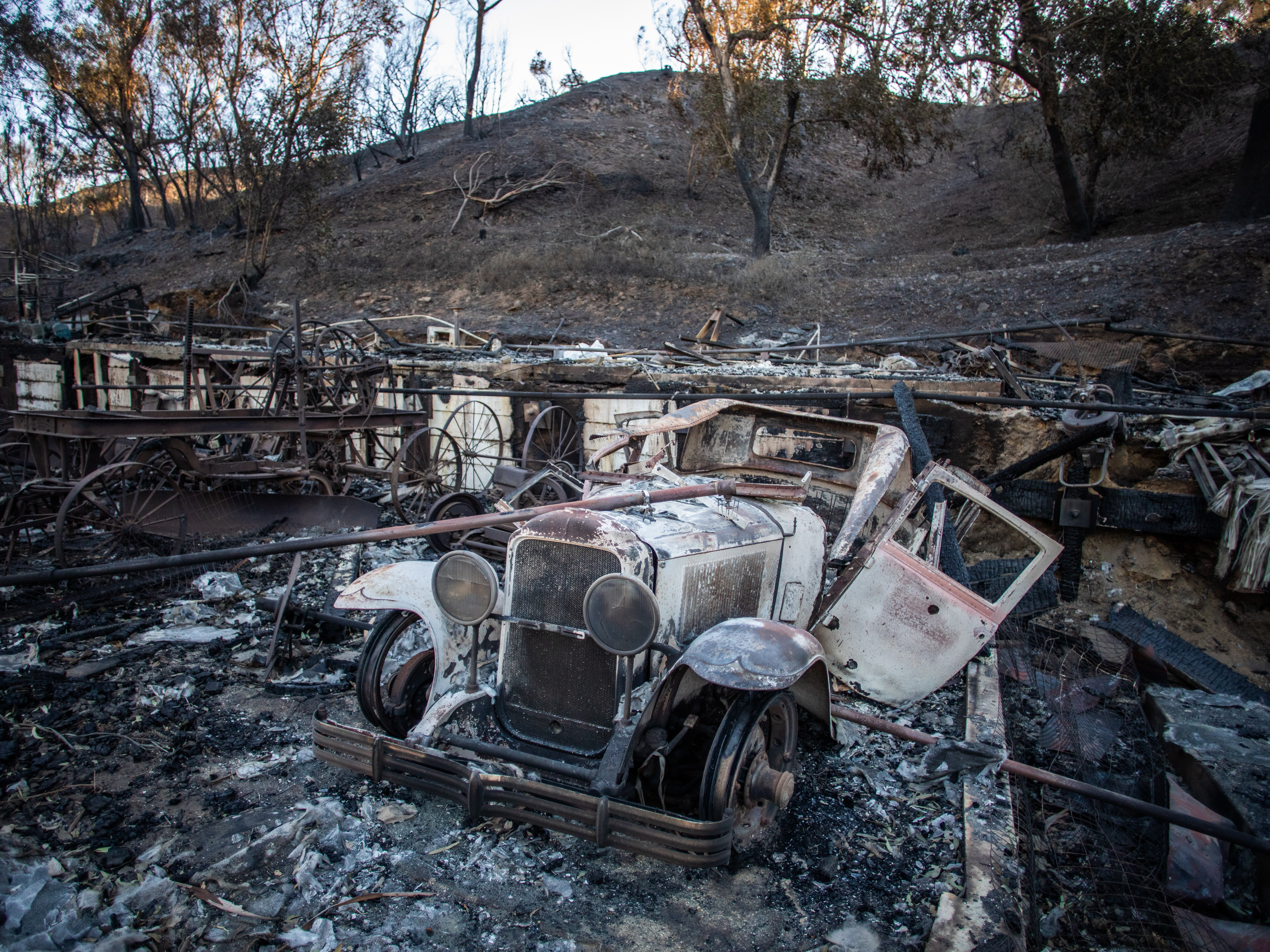 A car burned from the Palisades Fire is seen at Will Rogers State Park, in the Pacific Palisades neighborhood on January 15, 2025 in Los Angeles, California.