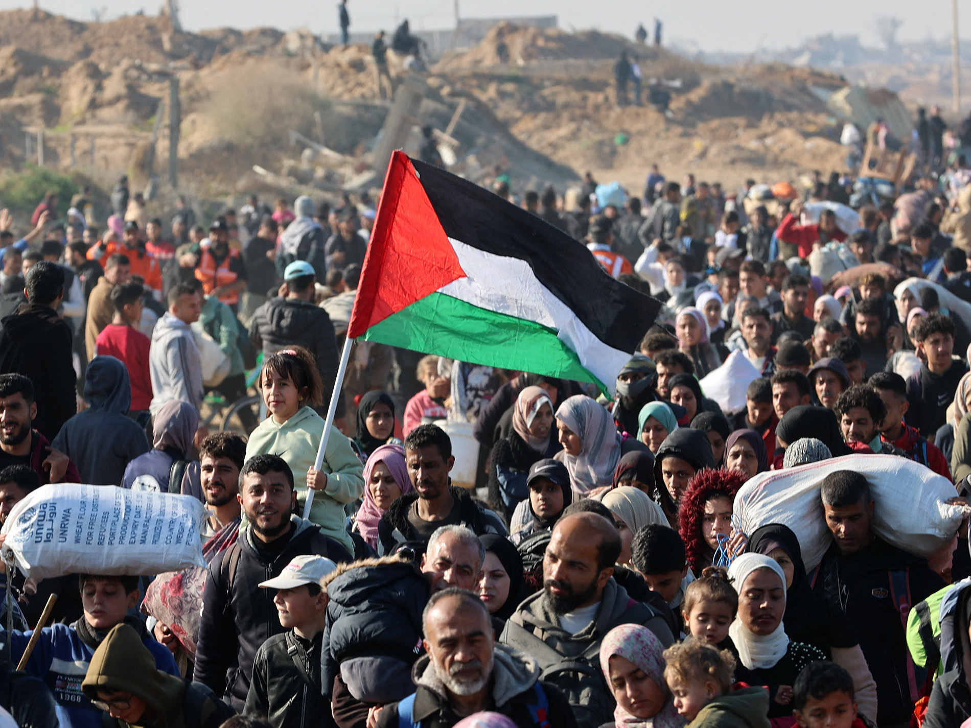 People walk along Gaza