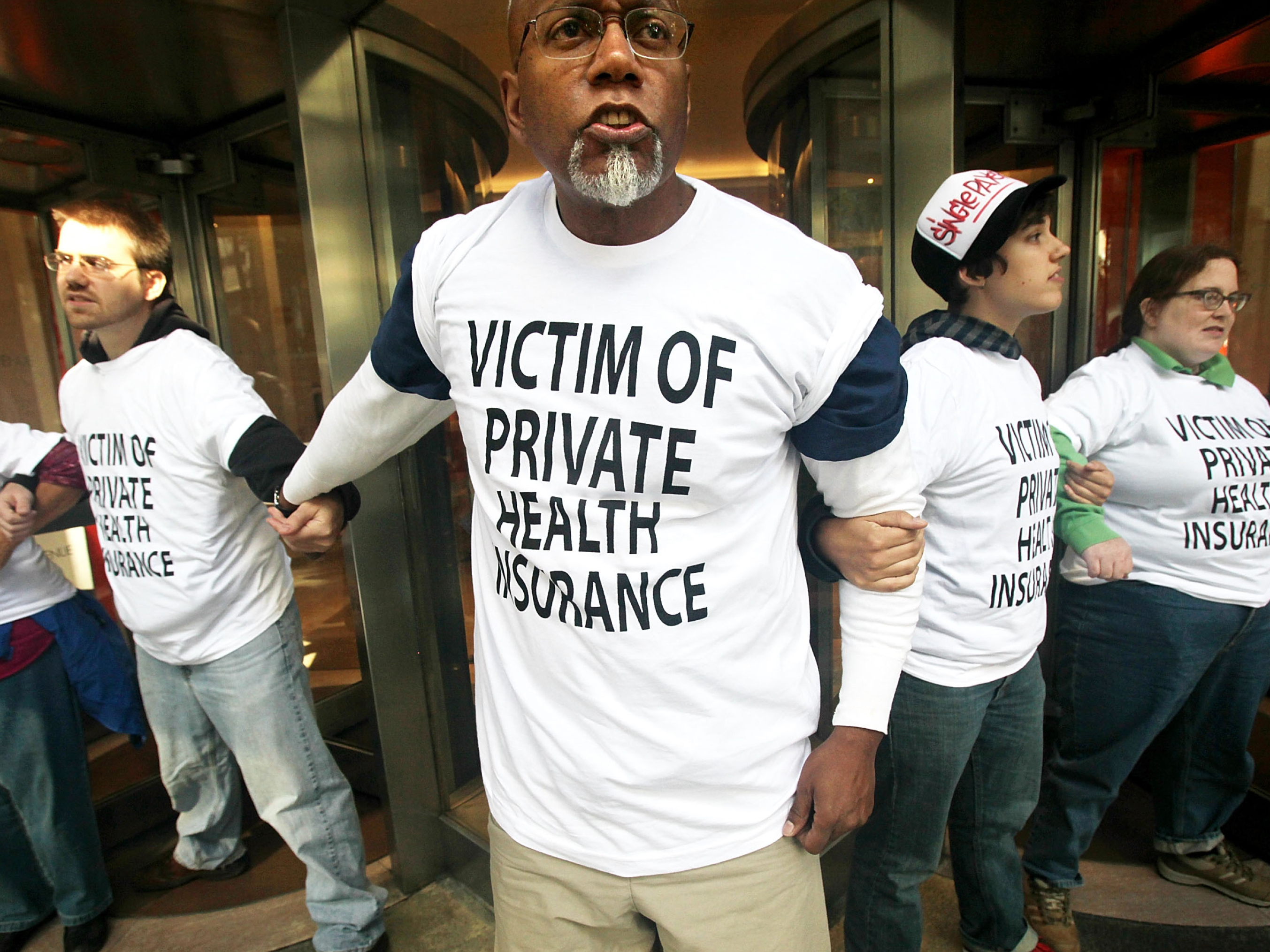 Health care reform supporters participate in a sit-in inside the lobby of a building where Aetna insurance offices are located September 29, 2009 in New York City. The protesters were eventually arrested by NYPD