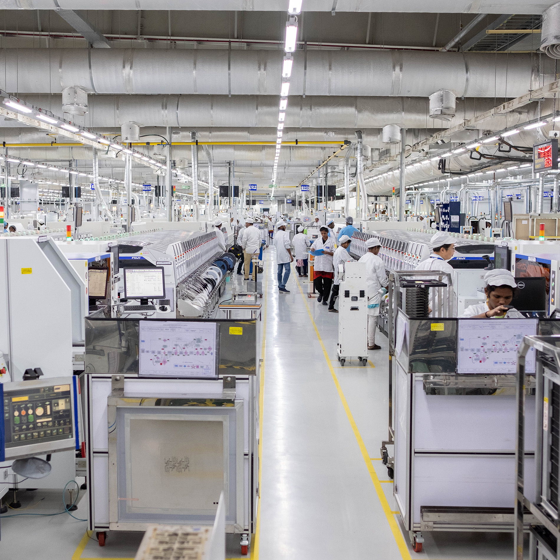 Employees work on an assembly line in the mobile phone plant of Rising Stars Mobile India Pvt., a unit of Foxconn Technology Co., in Sriperumbudur, Tamil Nadu, India, on July 12, 2019.