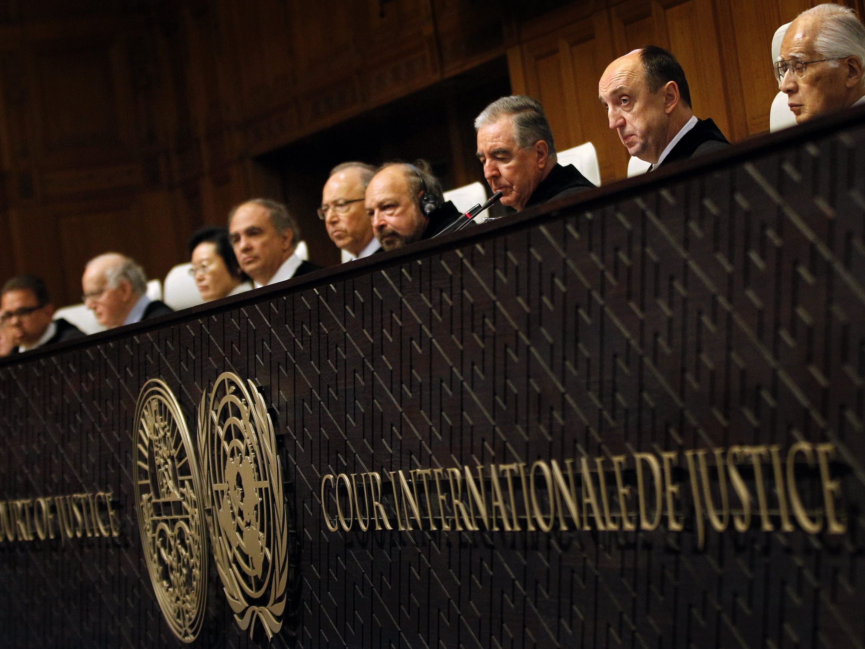 Members of the jurysit in the International Court of Justice in The Hague, The Netherlands, on January 27, 2014 during the judgment on the territorial dispute between Chile and Peru. AFP PHOTO/ANP BAS CZERWINSKI netherlands out (Photo credit should read BAS CZERWINSKI/AFP via Getty Images)