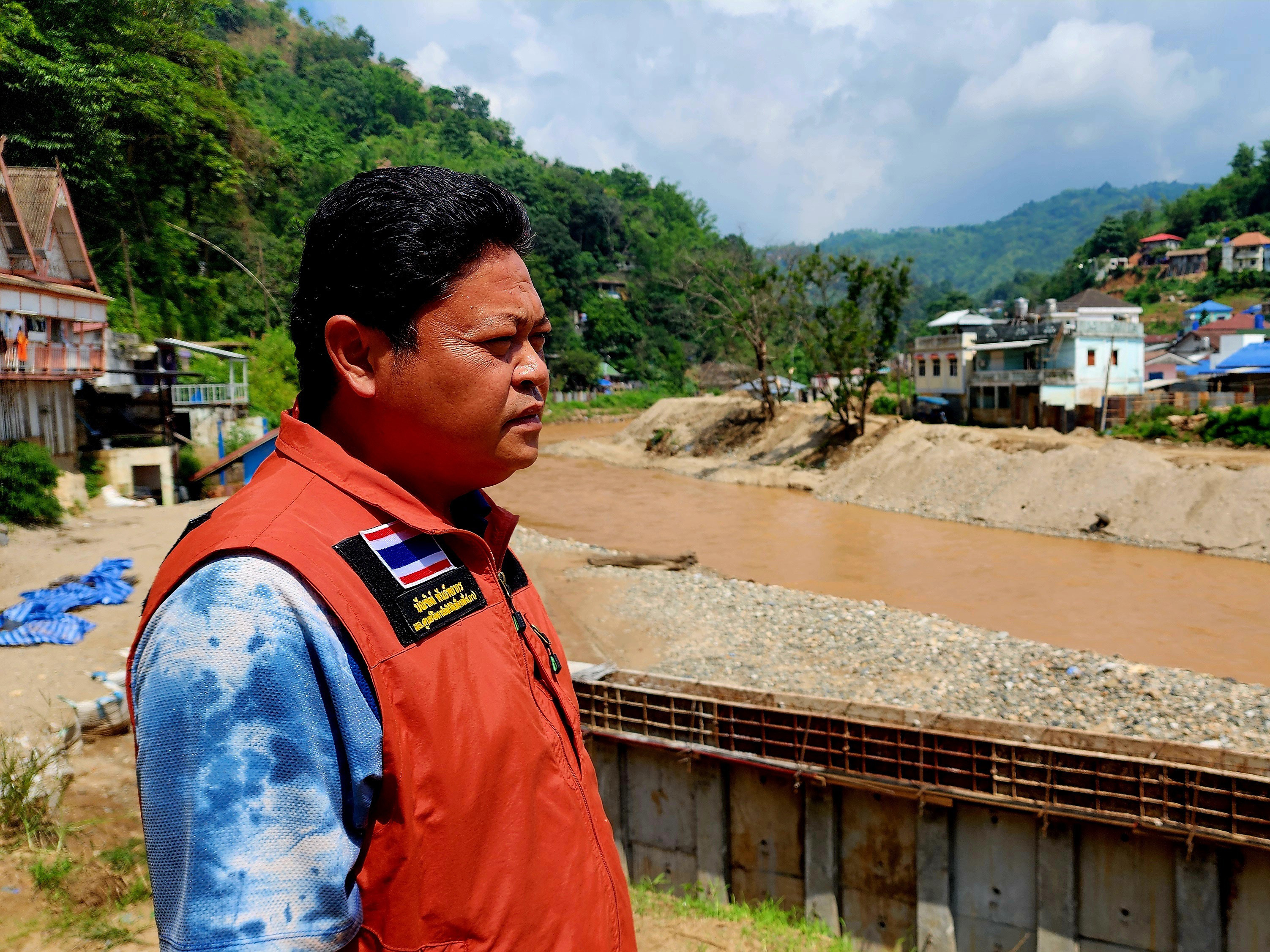 Bundit Pantarakon stands along the Sai river in Mai Sai, where the Thai Army is building flood control barriers along the river that forms the border between Thailand and Myanmar.