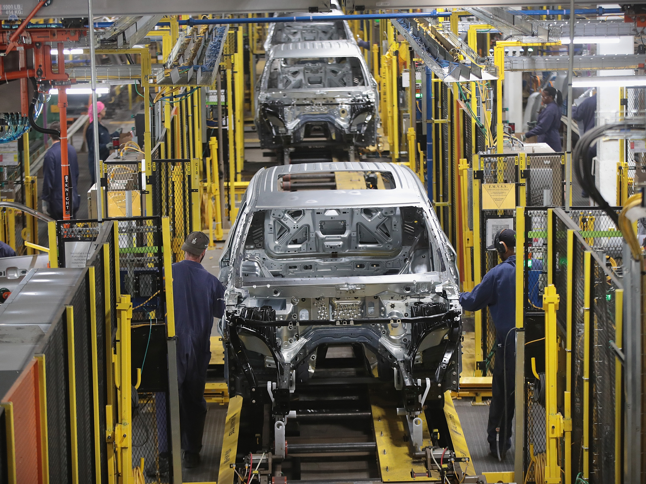 Workers assemble Ford vehicles at the Chicago Assembly Plant on June 24, 2019 in Chicago, Illinois.