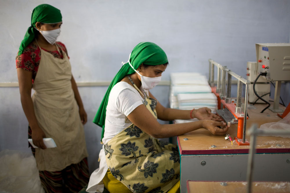 Young women create feminine pads at school.