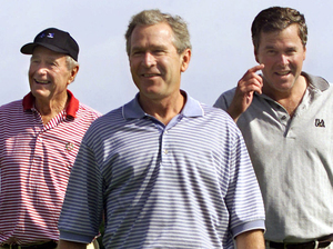 Photo of Jeb posing with H.W. and W. on golf course