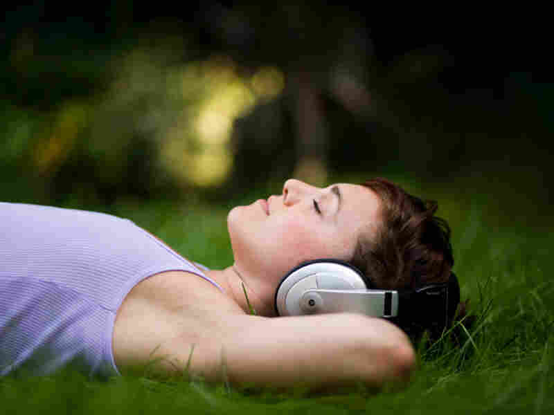 woman in headphones at night
