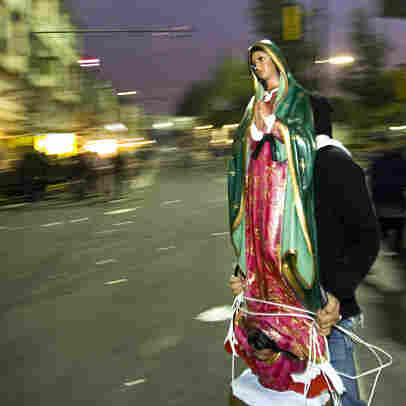 carrying madonna across street