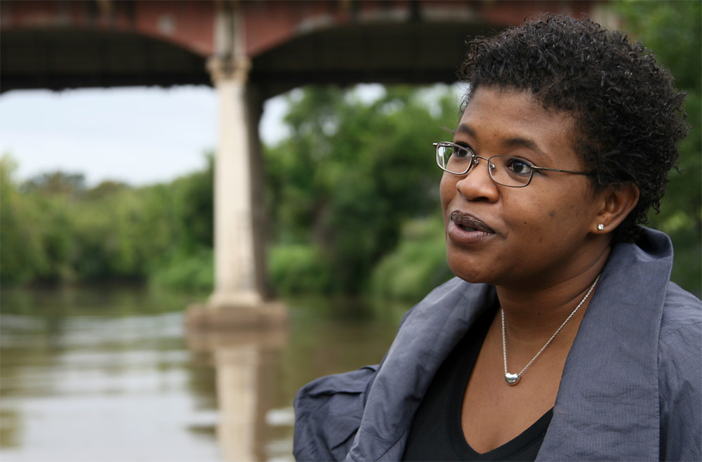 Author Attica Locke talks during a boat ride passing through downtown Houston on Buffalo Bayou.