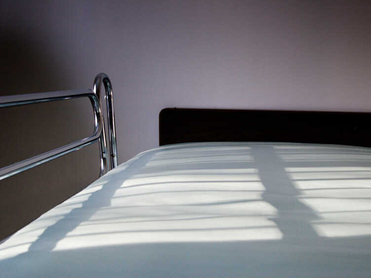 An empty hospital bed.