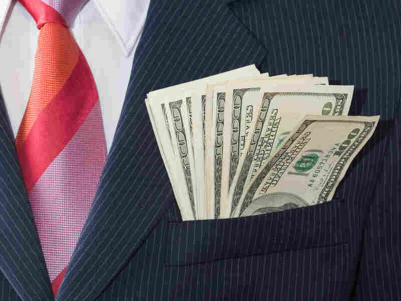 Cash in the pocket of a suit jacket