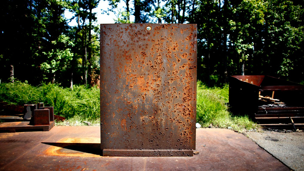 A scarred blast wall bears witness to the thousands of munitions exploded at a test site on the Aberdeen Proving Ground, a sprawling Army base north of Baltimore.