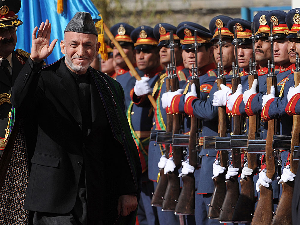 Afghan President Hamid Karzai passes an honor guard in Kabul before his swearing-in ceremony last month as the country's president for another five-year term. (AFP/Getty Images)