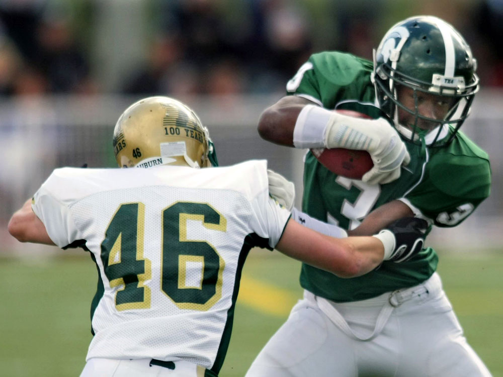 Kasen Williams avoids a tackle after a catch.