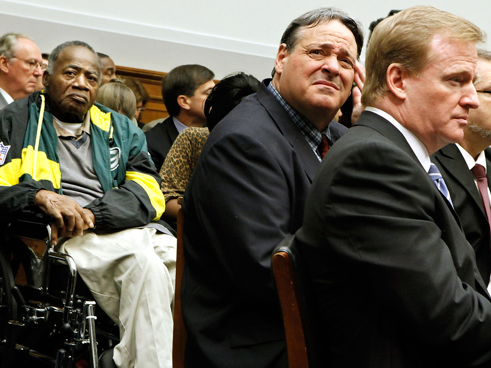 NFL Commissioner Roger Goodell (right) attends an Oct. 28 hearing of the House Judiciary Committee about football brain injuries with former NFL player Brent Boyd (center) and NFL Hall of Famer Willie Woods (left). (Getty Images)