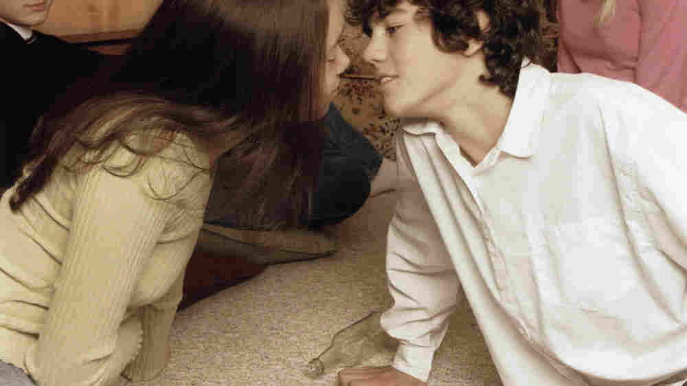 teenagers kissing