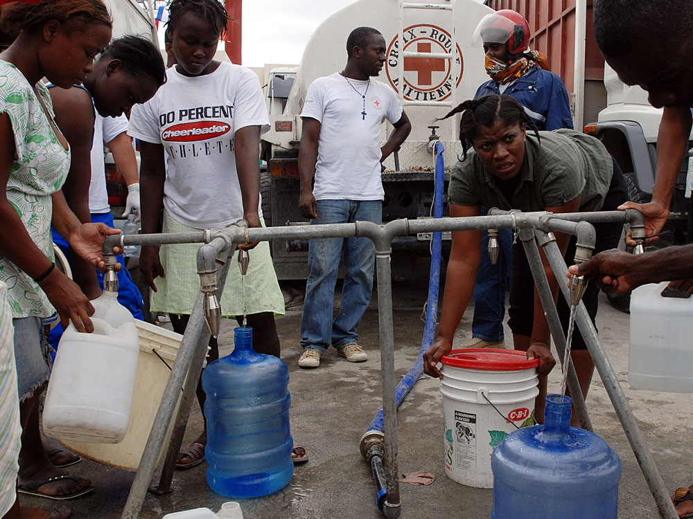 The Haitian Red Cross distributes water in Port-au-Prince. (AFP/Getty Images)