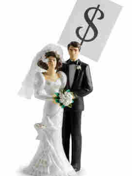 Wedding cake topper with a dollar sign