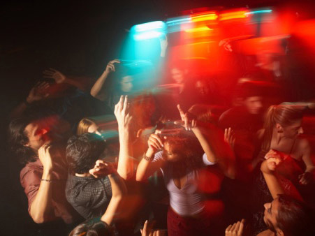 College students dance at a party.