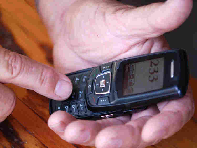 Hands holding a phone. iStockphoto.com