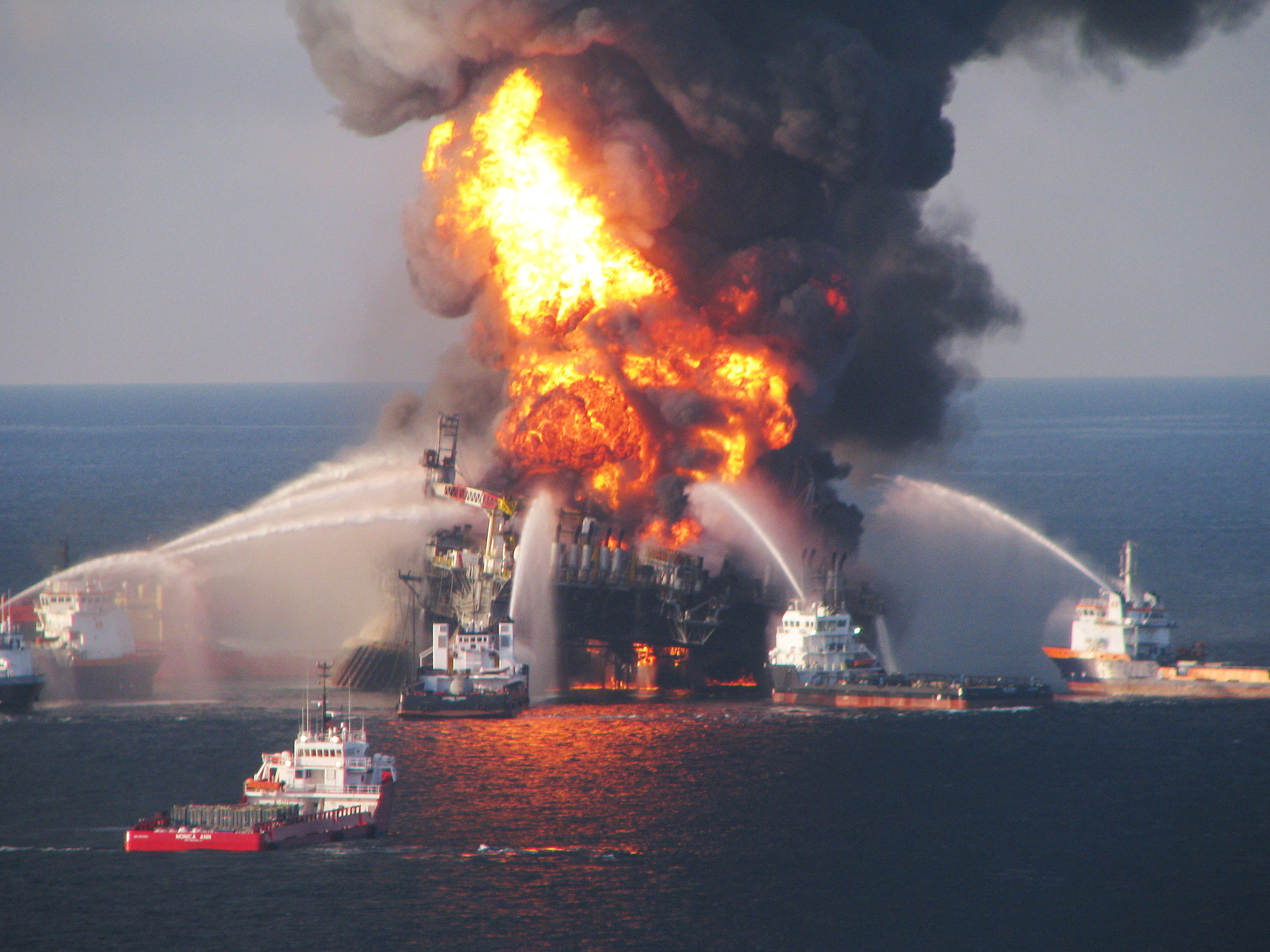 Fire boats battle a fire at the off shore oil rig Deepwater Horizon in the Gulf of Mexico off the coast of Louisiana. Multiple Coast Guard helicopters, planes and cutters responded to rescue the Deepwater Horizons 126 person crew after an explosion and fire caused the crew to evacuate. (U.S. Coast Guard via Getty Images)