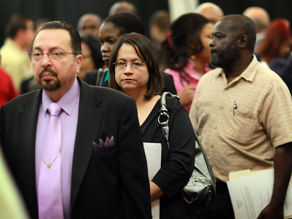 People attend a job fair April 22 in Davie, Fla. The unemployment rate rose to 9.9 percent in April, mainly because 805,000 job-seekers resumed their searches for work. (Getty Images)