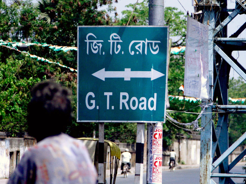 A sign directs travelers to the start of the Grand Trunk Road in Calcutta. (NPR)
