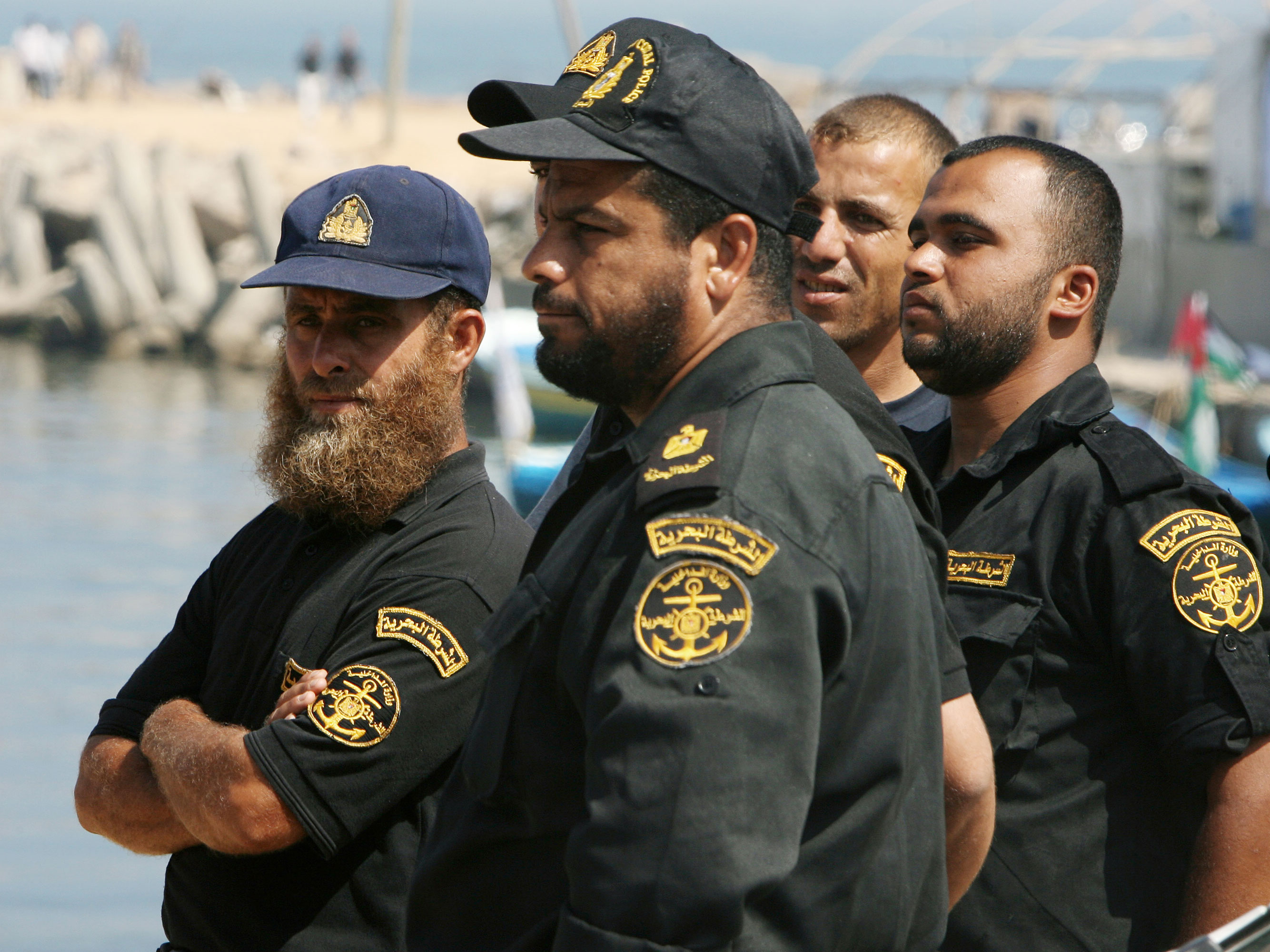 Palestinian Hamas naval policemen gather at the port of Gaza City on May 31, 2010, following a deadly Israel military raid on a Gaza-bound flotilla of aid ships in which several passengers were killed. (AFP/Getty Images)