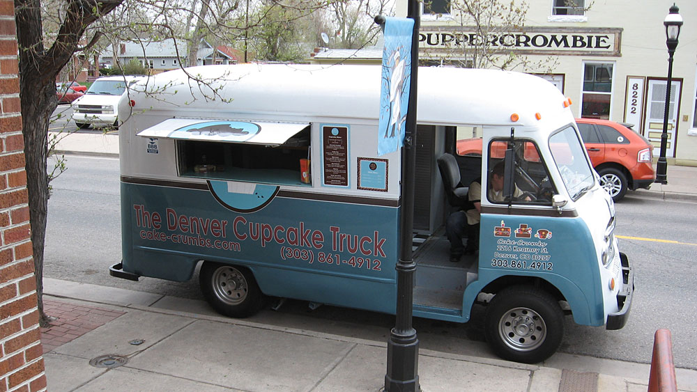 Each morning, Sean Moore loads up a 1969 Ford Vanette with cupcakes made at a bakery he co-owns with his wife. Once he finds a parking spot, he tells his customers through social media sites where he is -- and how long he'll be there. (NPR)