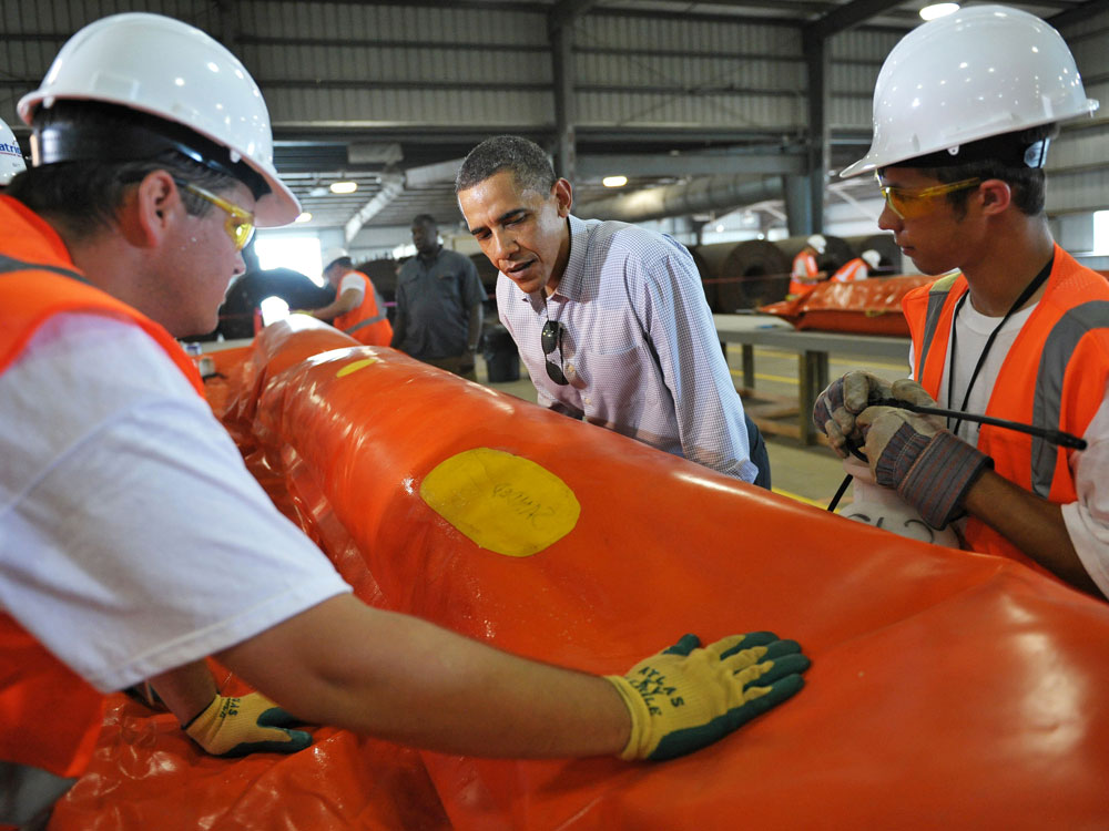 Monday, the president toured a facility in Theodore, Ala., where workers are repairing oil booms. (AFP/Getty Images)
