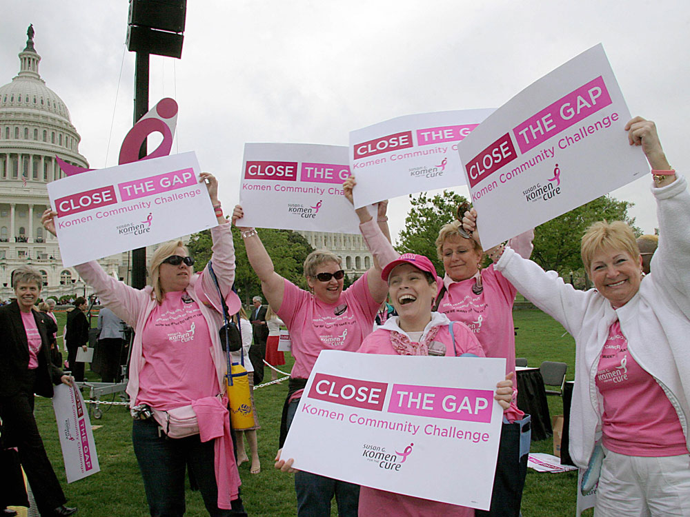 Breast cancer survivors from the Pink Ladies of Charles County in Maryland dance at a Komen Community Challenge rally on Capitol Hill in Washington, D.C. (AFP/Getty Images)