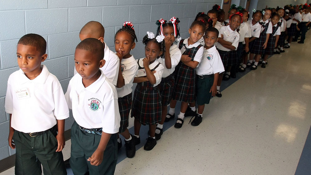 Kindergartners line up on their first day of school at Dr. Martin Luther King Jr. Charter School for Science and Technology in the Lower 9th Ward three years ago. While school leaders say they want diverse schools to reflect the city's population, most schools are still largely African-American. (Getty Images)