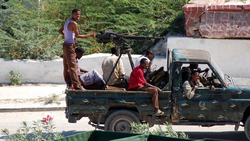 African Union troops are trying to bring stability to war-ravaged Somalia. They are locked in battle with al-Shabab, Islamist militants who claim ties with al-Qaida. Here, militiamen in Mogadishu, Somalia's capital, ride in a &quot;technical&quot; -- a pickup truck outfitted with weapons. This militia supports the African Union and  local government troops. (NPR)