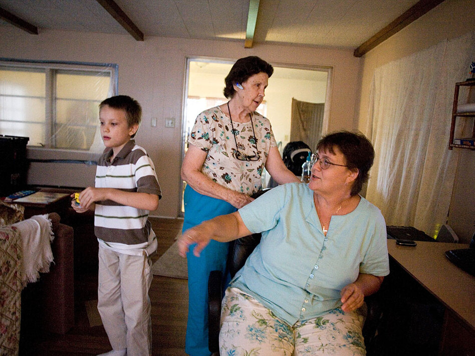 Rowena Sackow, right, lives with her mother Willie Pate, 73, in a double-wide trailer with her 8-year-old son Connor who has Asperger's Syndrome (Jason Henry/for NPR)