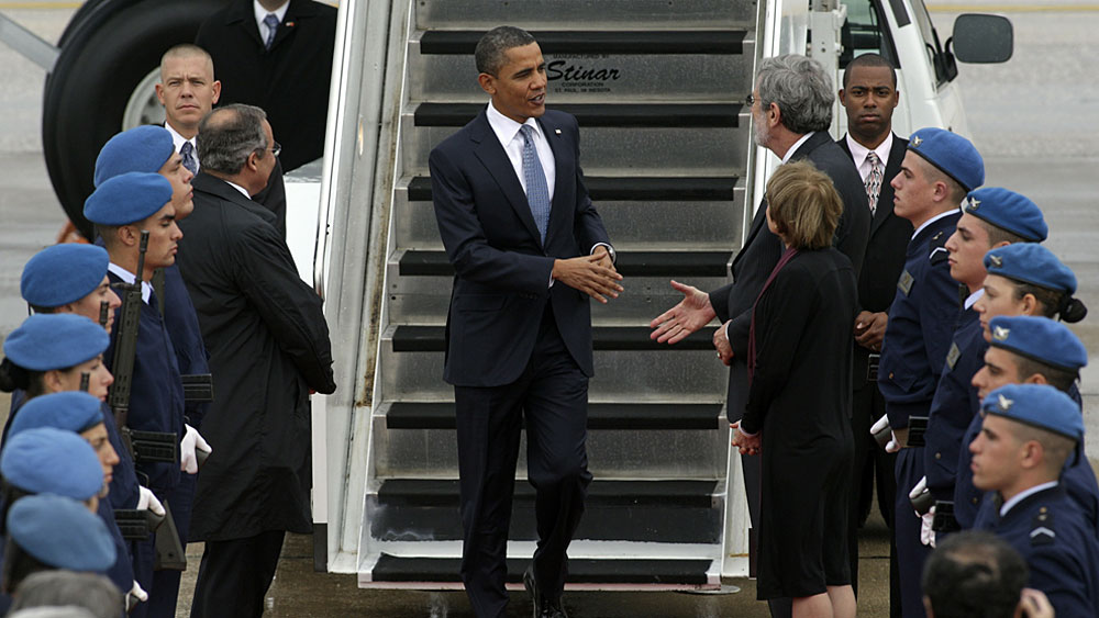 President Obama is welcomed by officials upon his arrival at Lisbon airport Friday for a NATO summit of heads of states and government. (AFP/Getty Images)